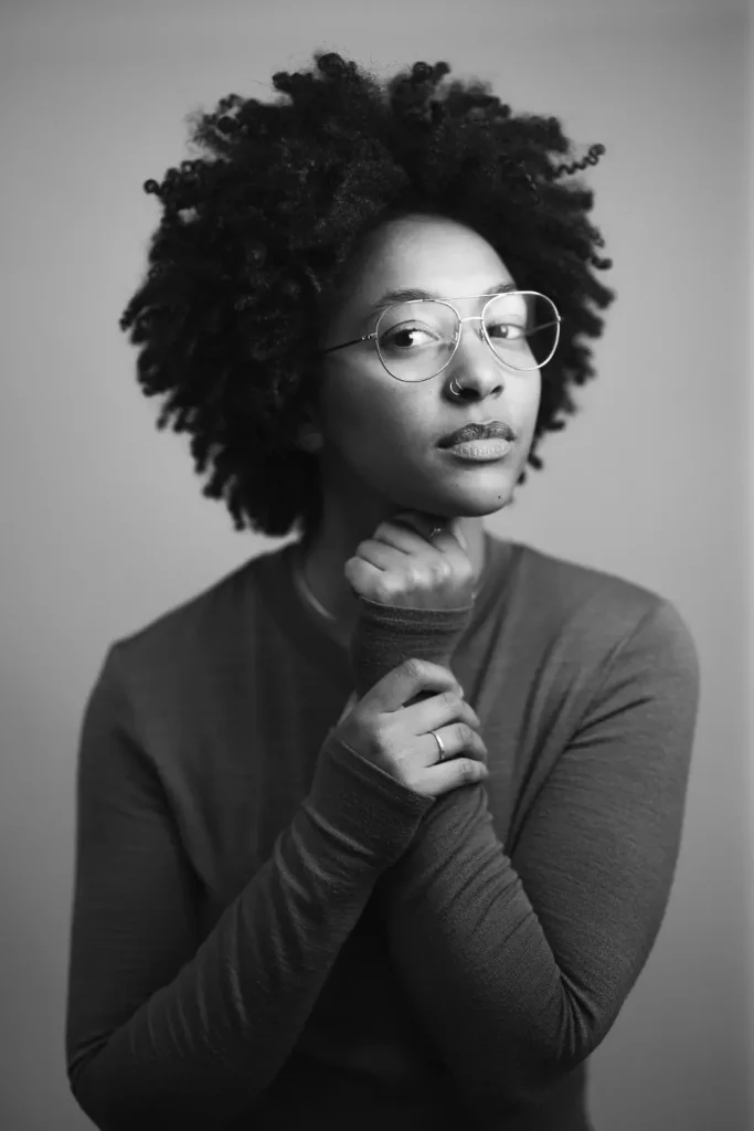Black and white portrait of a woman in glasses