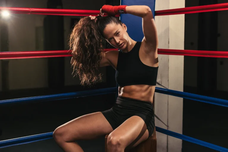 Boxer in the ring between red and blue ropes