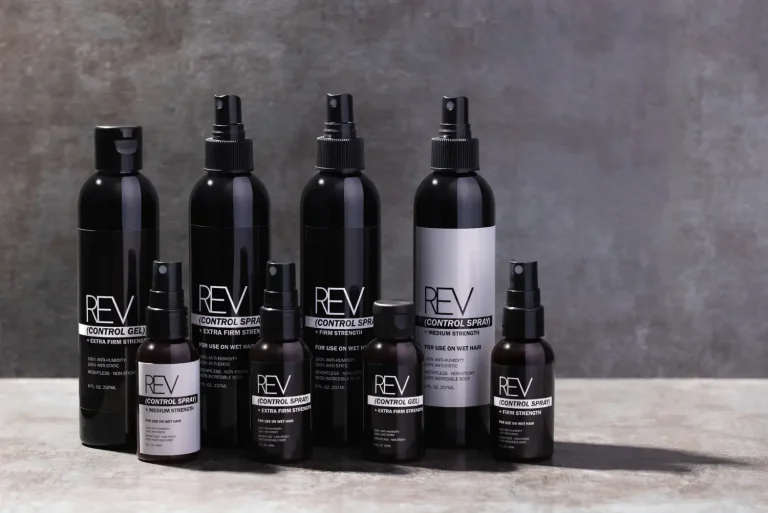 Hair care bottle lineup on a grey backdrop